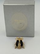 A Vintage Christian Dior Beetle brooch in original box.