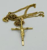 A 9ct gold crucifix on a fine 9ct gold necklace approximate weight 1.5g