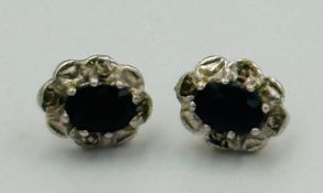 A pair of 9ct gold earrings in a sapphire style approximate weight 1.5g