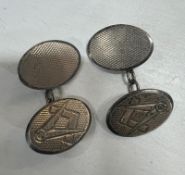 A pair of Masonic silver cuff links.