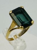 A 9ct yellow gold and green stone fashion ring approximate weight 3.9g and size L.