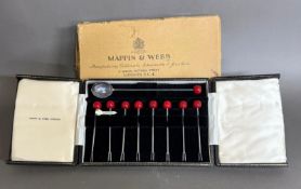 A boxed set of Mappin and Webb silver cocktail sticks with cherry finials, hallmarked for Birmingham