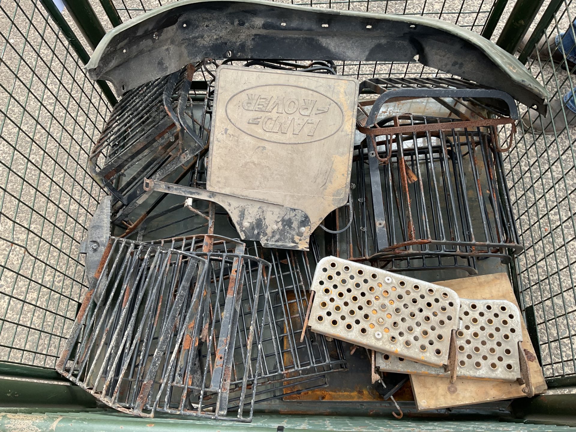 1x Stillage of Land Rover Spares, 30 Light Covers, Wing Cover, Mud Flap etc