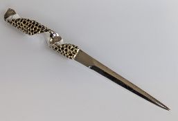 A silver parcel gilt letter opener with a pierced textuted spiral handle, hallmarked for Stuart Dev