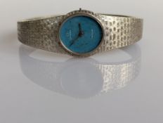 A vintage ladies Omega De Ville manual wristwatch with oval blue dial, white gold case 