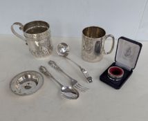 A late Victorian silver christening mug with profuse embossed and etched decoration, initialled