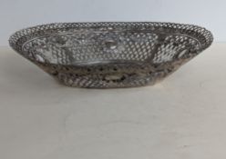 A late 19th century continental silver oval pierced basket with embossed decoration