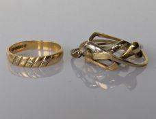 A white and yellow gold puzzle ring and a vintage yellow gold ring with diamond 