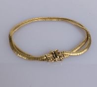 A yellow gold serpentine link bracelet, stamped 585, 17.4g