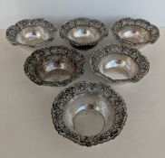Six mid-century profusely pierced and planished silver bowls, each stamped A Z 800, each 4.5 cm H
