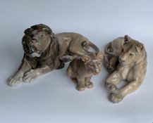 A Royal Copenhagen porcelain model of a recumbent lion, No. 1268 by Lauritz Jensen, 37 x 16 cm