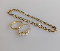 An 18ct yellow gold wedding band, 3mm, size O, 1.5g; a three-stone opal ring on a 14ct yellow gold 