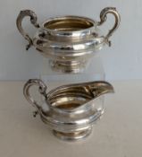 A Victorian silver twin-handled sugar bowl with girdle decoration on a raised base