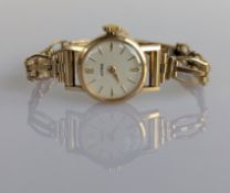 A mid-century ladies Astral dress watch with a 9ct yellow gold case and pierced strap, 9.5g 