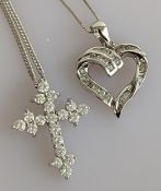 A diamond encrusted crucifix pendant chain on a white gold setting, hallmarked 18ct, 5g