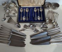 A cased set of six teaspoons and sugar tongs, initialled, hallmarked for Robert Pringle & Sons, 1935