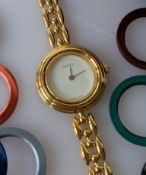A ladies Gucci quartzwatch with ten multi-coloured interchangeable bezels, each 26 mm