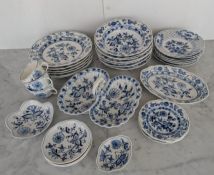 A twenty-eight piece Meissen Onion pattern part dinner service, mostly seconds, comprising: dinner 
