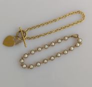 A cultured pearl collet-set bracelet with lobster clasp and a T-bar clasp belcher-link bracelet 