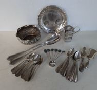 A miscellany of silverware to include an Indian silver bowl with wavy rim border and profuse embosse