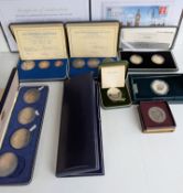 An assortment of cased silver commemorative and other loose silver coins to include