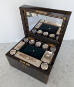 A Victorian brass bound coromandel wood travel vanity box with ten engraved silver plated topped cut