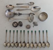 A set of twelve Art Deco coffee spoons with green enamel chevron decoration, each 9.5 cm