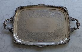 A George V silver two-handled oblong butlers tray with applied gadroon rim and scallop decoration