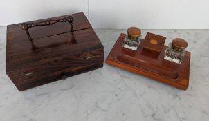 A Regency rosewood travelling desk stand with carry handle, opening to reveal fitted compartments an
