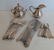 An Italian silver 800 cream jug and lidded sugar bowl together with a set of ten Italian 800 silver 