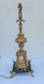 A 19th century French gilt metal candle stick holder holder, fitted for electricity, raised 