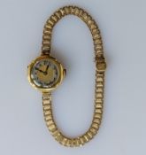 An early 20th century ladies wristwatch with Arabic numerals, case 18ct gold on a later 9ct gold 