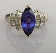 A 3.29 carat Art deco-style tanzanite and diamond set dress ring on a 14ct white gold claw setting