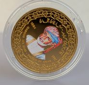 A cased 1994 gold .917 proof one Rial Qaboos Al Bu Said Dynasty 250th Anniversary coin
