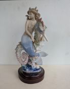 A Lladro boxed 'Prince of the Sea' 01822, figure on a wood stand, 31 cm H, signed by Polope & Perez