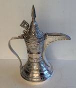 A Turkish / Islamic white metal dallah or coffee pot (tests as 800 grade silver), 568g. 27 cm H