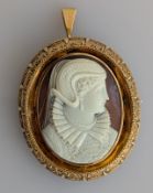 A yellow gold framed oval cameo brooch/locket, 56 x 47mm, 30g