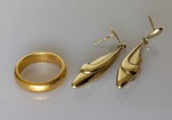 A 22ct yellow gold wedding band, 9.65g and a pair of stylized yellow gold earrings, no backs, 2.76g