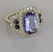 An Art deco-style 4.31 carat tanzanite, sapphire and diamond dress ring on a 14ct white gold setting