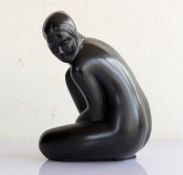 A Lalique black crystal crouching Venus figurine in a satin finish, created in 2004, signed Lalique 