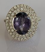 A 4.79 carats tanzanite and diamond-set cluster ring on a 14ct white gold claw setting