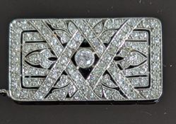 An Art Deco diamond and platinum rectangular plaque brooch, lattice design, the central European-cut