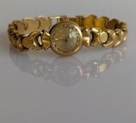 A vintage Omega ladies manual dress watch with baton markers in a gold case and fancy-link bracelet 