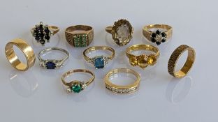 An assortment of eleven vintage gem-set rings in 9ct yellow gold and platinum, mixed sizes