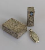 A Japanese sterling silver lipstick compact with profuse foliate decoration, stamped K Uyeda 