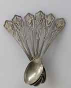 A set of six silver coffee spoons with pierced handles, stamped sterling, 55g