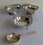 A pair of salts with gadrooned rims on raised bases, unmarked, but testing for silver