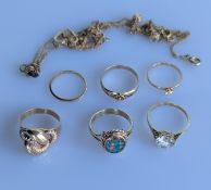 A yellow gold stylized shell ring on a tapering shank, stamped 14ct, 2.6g; an oval fire opal ring