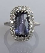 A 4.78 carat cushion-shape tanzanite and diamond ring on a 14ct white gold setting