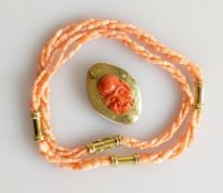A three strand coral necklace with yellow gold links and clasp, hallmarked 18ct gold, 56 cm, 38.7g